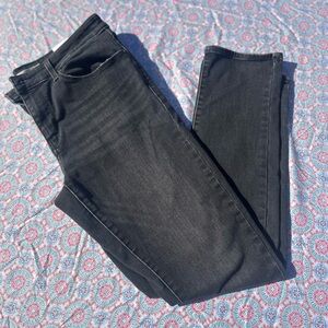 Levi Black Skinny Jeans with Subtle Texture and Distressed Look